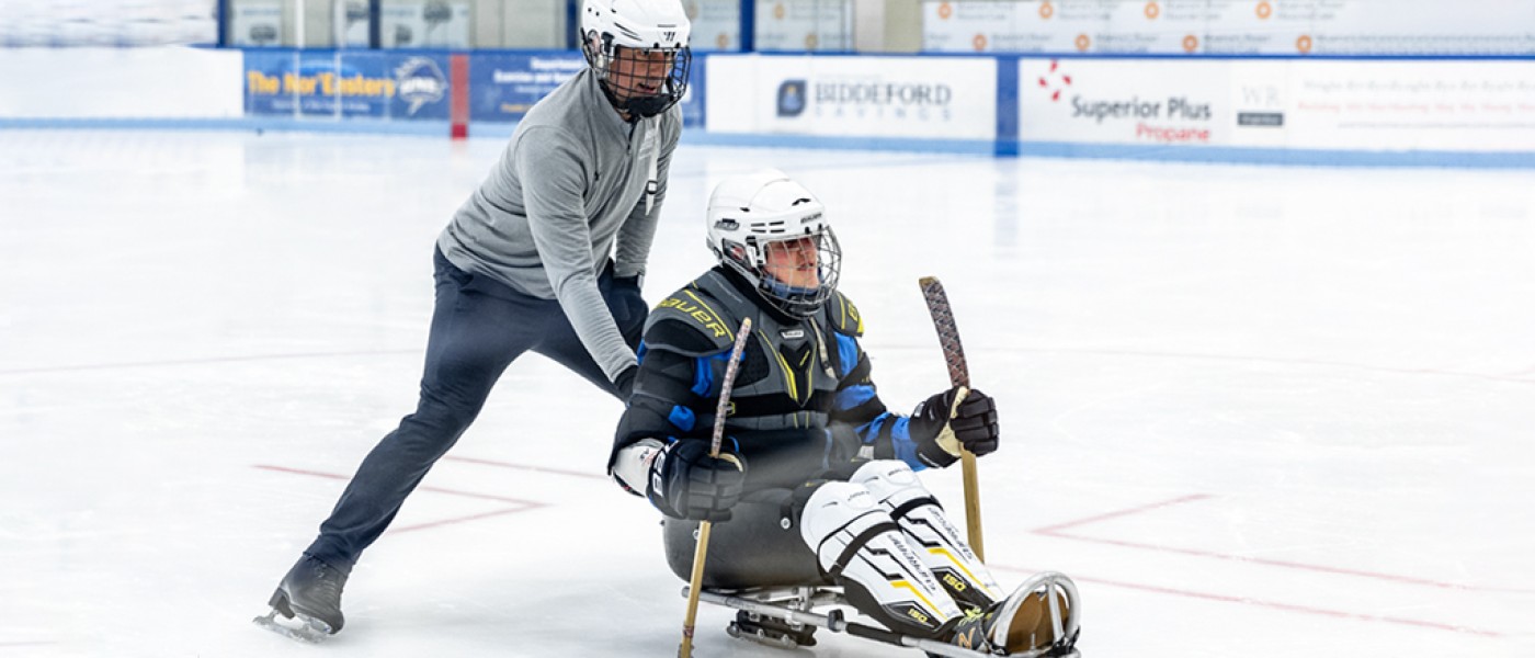 51ƷDoctor of Physical Therapy students help out with a Maine Adaptive Sledding event at the Harold Alfond Forum